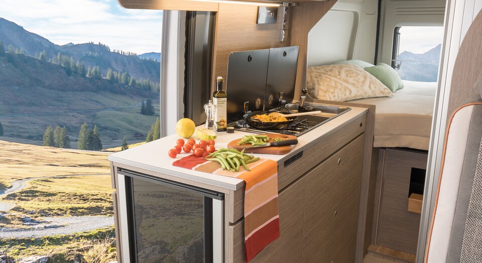 Spacious Kitchen | Double-hinged refrigerator to enable easy access from inside and outside the vehicle